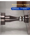 Stainless Steel Magnetic Door Stopper With Strong Hold Safety Catch For Interior Rooms And Bedrooms In Sleek Black Design To Limit Door Movement Securing Fixed Positions Smoothly, showing no-drill strong magnet.