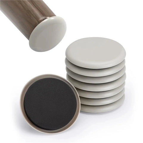 Heavy Duty Furniture Glides And Movers Pads With Strong Self Adhesive Backing, circular pads in a stack plus one from below.