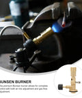 Pro Grade Brass Bunsen Burner with Tripod Stand in use for heating a metal rod, gas flame visible, Studio and Workshop tool