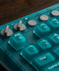 Retro 87 Key Wireless Mechanical Keyboard Hot Swap Silky Linear Switches with volume and Bluetooth buttons in clear blue finish.