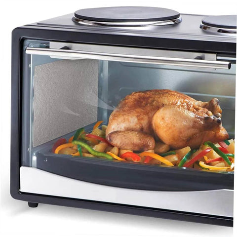 Microwave oven with Replacement Mica Plate Sheets, 20 Pack installed, featuring heat insulation and waveguide shield, cooking chicken.