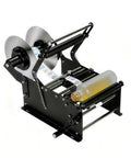 LUNISOLVEIL Manual Bottle Label Applicator With Handle applies labels on a clear bottle, designed for efficient DIY sticker placement.