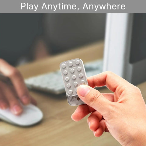 Heavy Duty Metal Fidget Slider Featuring Unlimited Rotary Push Brick Design For Adults ADHD Anxiety And Stress Relief Smooth As Butter Gliding Action Kick Back And Chill Anytime held in hand near computer.