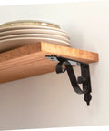 Heavy Duty Iron Triangle Shelf Brackets Black Metal Corner Supports 4 Pack holding wooden shelf with plates.