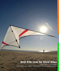 Stunt kite flying on a sunny beach with colored kite lines shown, showcasing 0.8mm UHMWPE Micro Cord Rope Whipping Twine For Heavy Duty Canvas Tarps And Bags Survival And Backpacking Emergency Line 100 Ft Length 220 Lb Break Strength Self Lubricating Abrasion Resistant Utility Cord.