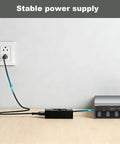 2 Pro Switching Adapter 24V Power Adapter For Bambu Lab AMS 2 Pro Automatic Material System, Plug And Play Compatible With ADS-96HLA-19-1 24096E, Safe 24V Cord Charger For Reliable Filament Feeding And Quick Swaps. Black power adapter connected to Bambu Lab AMS 2 Pro on a desk.