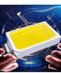 Heavy Duty LED Floodlights Hella Bright 6000K Daylight wall mount fixture held between hands with yellow lens and white casing.