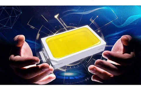 Heavy Duty LED Floodlights Hella Bright 6000K Daylight wall mount fixture held between hands with yellow lens and white casing.