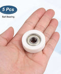 5 Pack Dead Silent Nylon Track Rollers With Rock Solid Precision Bearings 10mm Bore shown in hand with visible inner metal bearing.