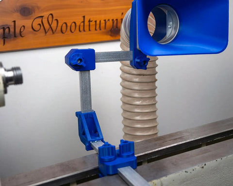 Straight Up Industrial Dust Collection Adapter For Split Bed Wood Lathe with three-way pivot mount over a lathe.