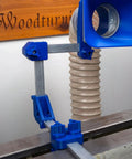 Heavy Duty Custom Fit Dust Collection System For Split Bed Wood Lathe with blue hood and adjustable clamp on lathe.