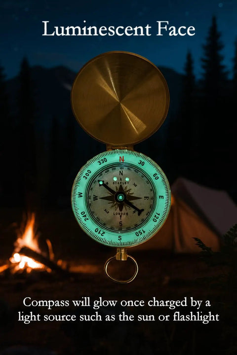 Glow In The Dark Brass Pocket Compass For Kids with luminescent dial in a camping setting at night.