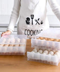 Fridge Egg Holder With 60 Grid Storage, 2 Layer Drawer Style Egg Carrier Box showcased in a kitchen setting, filled with eggs