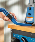 Flexible Click Connect Crevice Vacuum Attachment For Deep Cleaning In Tight Spaces used on a workbench with sawdust removal