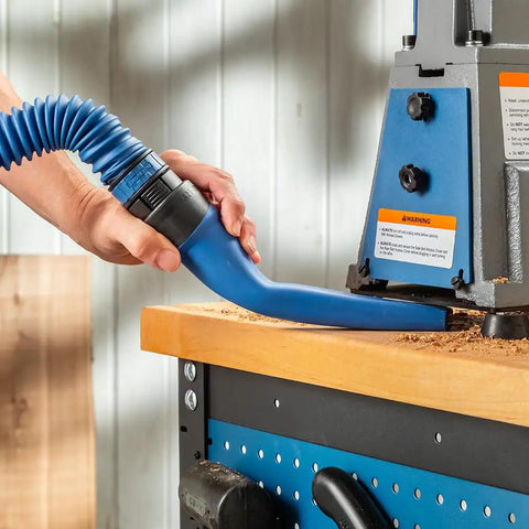 Flexible Click Connect Crevice Vacuum Attachment For Deep Cleaning In Tight Spaces used on a workbench with sawdust removal