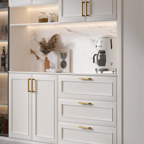 Champagne Bronze Cabinet Pulls Two And A Half Inch Brushed Bronze Drawer Handles installed on white kitchen cabinets.