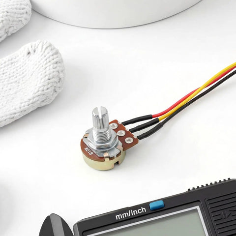 10K Linear Taper Rotary Potentiometer with knurled shaft and prewired XH2.54 cable on white surface.