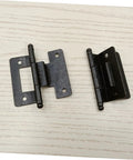 Two black metal cabinet door hinges with mounting plates for kitchen or bathroom cabinets