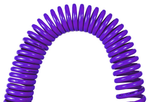 Close-up of purple polyurethane recoil air hose for air compressors one quarter inch inner diameter by twenty five feet coiled design.