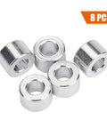 Five aluminum shock spacers, part of an RC Car Shock Spacers Set With Eight Aluminum 6mm Upper Mount Spacers For Axial SCX10 Crawler And Off Road RC Rigs.
