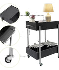 Close-up of Ride Smooth Black Two Tier Mobile Bar Cart With Secure Roller Wheels Home Serving Stand showcasing top drawer and decor.