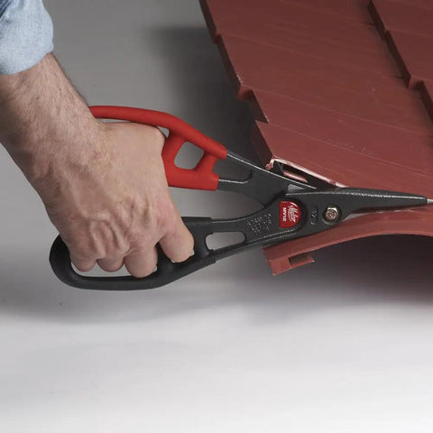 Hand using All Purpose Snip For Vinyl Siding Aluminum Trim Coil Vinyl Flooring Carpeting Leather And Landscaping Edging A Heavy Duty Alloy Steel Blade