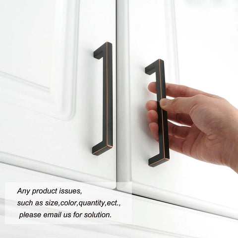Hand holding Oil Rubbed Bronze Solid Square Kitchen Cabinet Handle 5 Inch on white cabinet door, easy install hardware