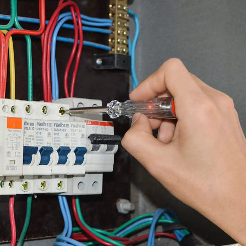 Electrician using Heavy Duty Pro Grade 11 Piece VDE Insulated Screwdriver Set 1000V with Magnetic Black Tips on circuit breakers