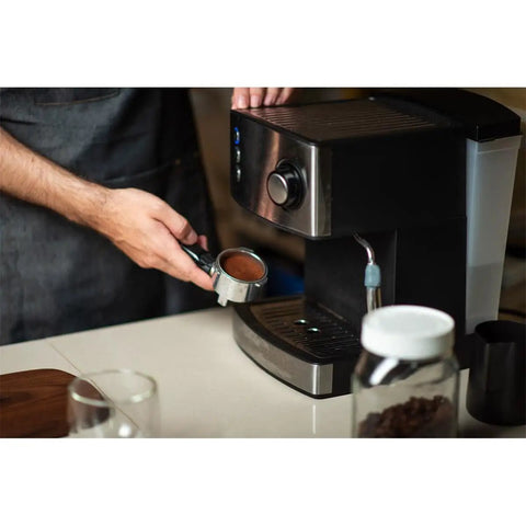 Person making coffee on espresso machine with Water Filter Softener DLSC002 For Delonghi Espresso And Bean To Cup Machines Helps Reduce