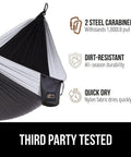 Side view of black and gray durable camping hammock built tough with heavy duty tree straps holds up to 500 lbs steel carabiners.