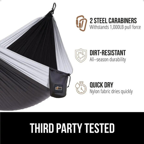 Side view of black and gray durable camping hammock built tough with heavy duty tree straps holds up to 500 lbs steel carabiners.