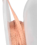 Close-up of Pro Grade Premium Solder Wick Desoldering Braid for Electronics Repair showing red copper wire.