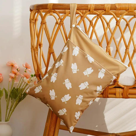 Two Pocket Wet Dry Bag Set With Handle Waterproof Reusable Storage on chair with bear pattern