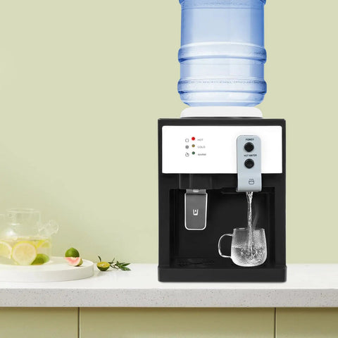 Top Loading Hot And Cold Desktop Water Dispenser With 500W Heating And 75W Cooling Delivers 1.32 Gal Per Hour Hot Water 110V US Plug White Water Cooler For Home Office And Desk Setup sitting on a kitchen counter.