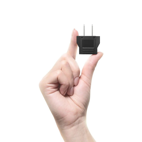Hand holding EU To US Travel Plug Adapter 2 Pack With Secure Fit Type C And E F Schuko To US Converter, compact black design