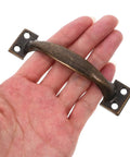 Vintage Style Metal Cabinet Handles Set Of 12 Curved Drawer Pulls For Kitchen Cabinets, shown with ergonomic grip in hand