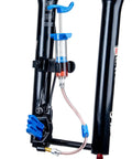 BKM12 Hydraulic Brake Bleed Kit For Mineral Oil With Dual Syringes, mounted on a bike fork, showcasing bleeding process.