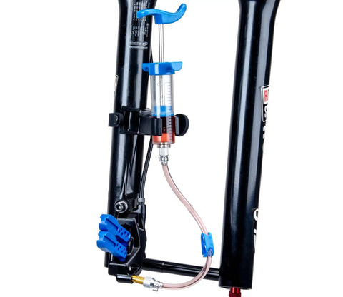 BKM12 Hydraulic Brake Bleed Kit For Mineral Oil With Dual Syringes, mounted on a bike fork, showcasing bleeding process.