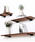Tough As Nails Dual Pack Wall Mounted Floating Shelf Brackets In Industrial Black with wooden shelves for decorative storage.