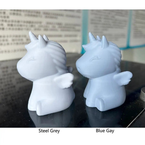 3D printed unicorn figures in steel grey and blue using PLA MAX 1.75mm Filament For 3D Printing, Reinforced Strength With PLA Pro Plus Tech.