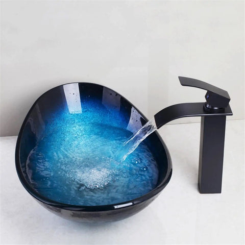 Bathroom Sink Tempered Glass Bathroom Vessel Vanity Sink with blue gradient water flowing from sleek black faucet.