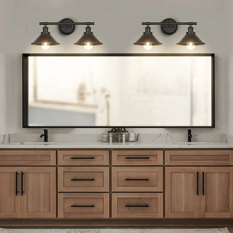 Black Two Light Vanity Wall Sconce for Farmhouse Bathrooms above large mirror with wooden cabinet and modern faucets