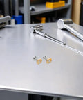 Brass Hydrofoil Mounting T Nuts With Screws M6 for wing foil boards with tools on metal table