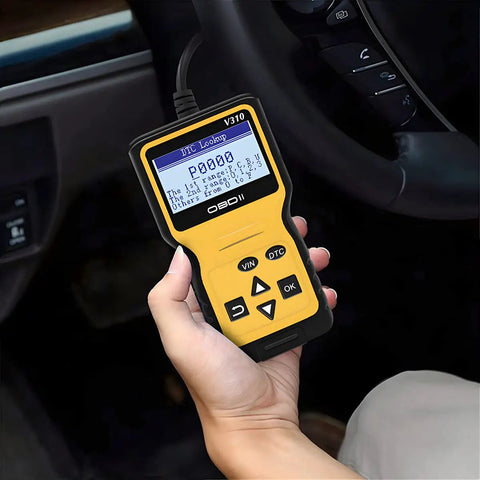 Hand holding yellow OBD2 Scanner Code Reader for Cars Read and Erase Fault Codes Check Engine Light Emission Monitor Real Time Data