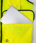 Class 2 High Visibility Safety Vest In Neon Green with a tablet in the pocket, showcasing storage functionality for construction use.