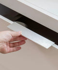 Close-up of 15 Pack Brushed Nickel Edge Finger Cabinet Pulls for kitchen cabinets and furniture, hand touching aluminum alloy handle.