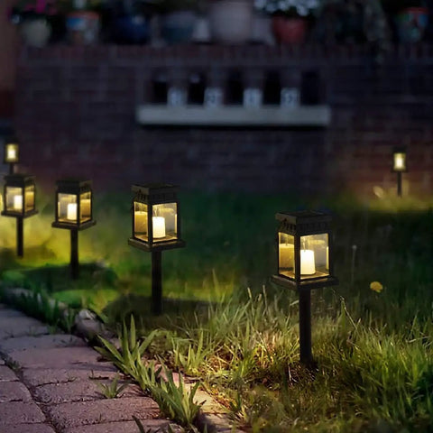 8 pack solar hanging lanterns outdoor with candle effect warm white light illuminating garden path, perfect for yard
