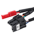 Electric wheelchair power controller module in black plastic with wiring harness and red two-pin connector.