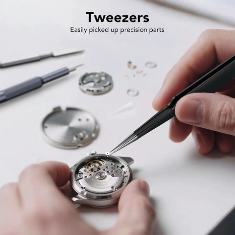 Using tweezers from Grab And Go 50 In 1 Precision Screwdriver Set With Security Torx And Magnetic Mini Repair Kit to assemble a watch.