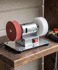 Knockout Bench Top Electric Grinding Machine With Rock Solid Anti Slip Base For Smooth Metal Polishing And Heavy Duty Rust Removal Precision Edge Control Tool on a wooden shelf.